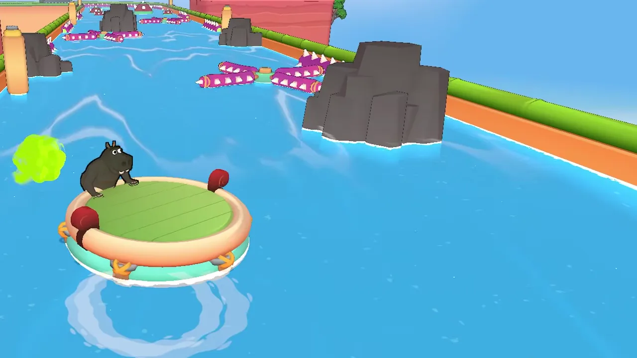 A grey hippo on the rim of a round raft with a green puff off its left side, a large rock ahead and purple spiked logs beyond