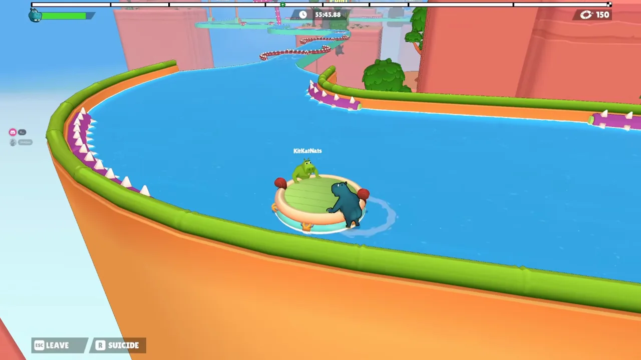 A raft with two hippos drifts around a wide canal bend with no cloud, and the top-left bar is green at about two thirds