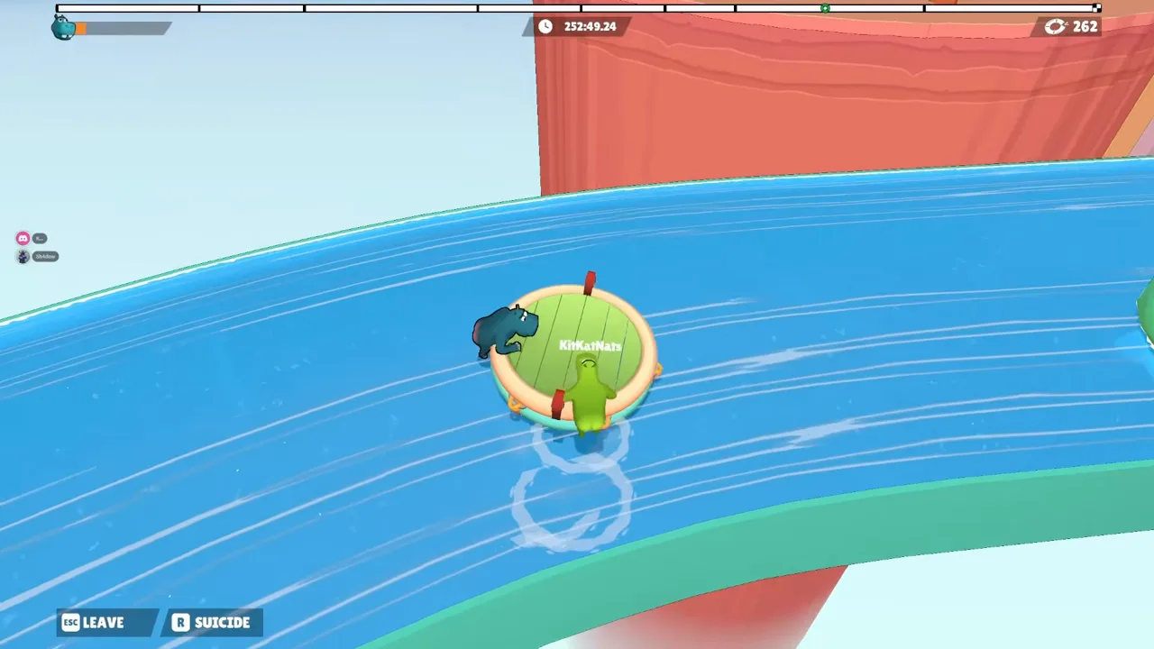 Two hippos on a raft crossing a wide curved river with no cloud and only a small orange stub left in the top-left bar