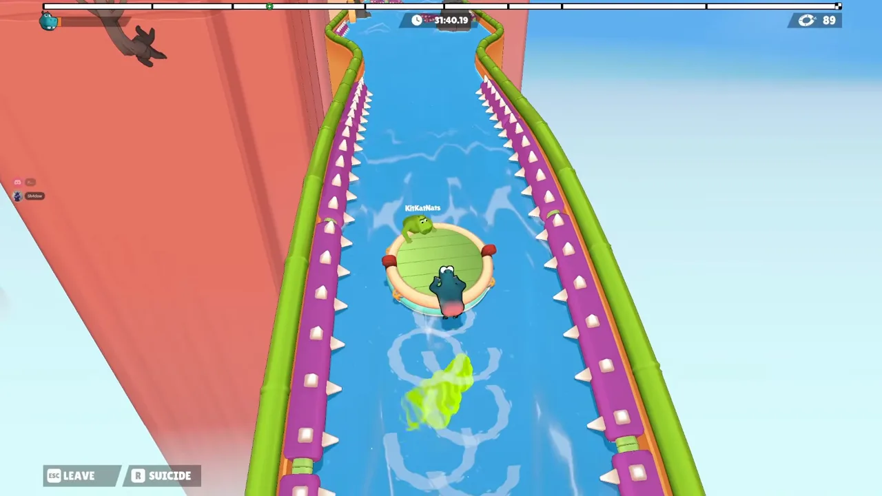 A raft in a narrow spiked canal with a large green cloud below it and the top-left bar almost empty